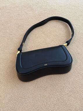 JW PEI Black Curved Shoulder Bag with Gold Accents